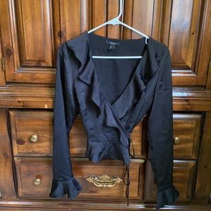 low-cut black ruffle top